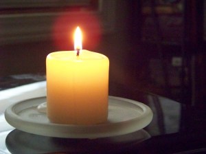 note my useless laptop under the candle